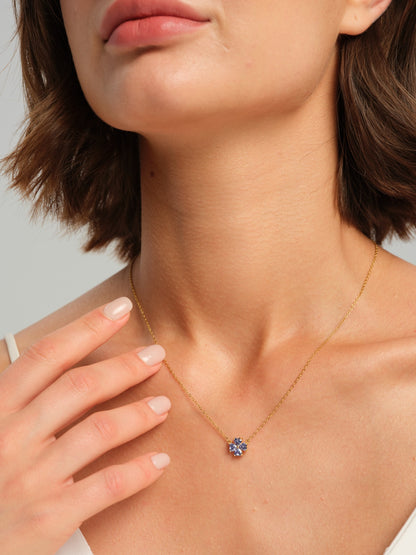 Blue floral necklace worn on a model, front view